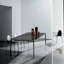 For outdoor entertaining, display vases of fresh picked flowers or pots of succulents at the center of the table. Slim Rectangular Glass Dining Table Klarity Glass Furniture