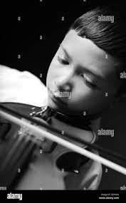 Child playing violin Black and White Stock Photos & Images