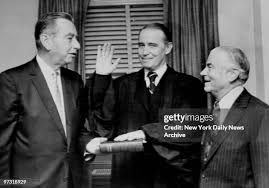 Judge Owen McGivern being sworn in by Gov. Malcolm Wilson and Mayor... News  Photo