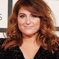 Meghan's short red hair.