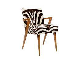 The sculptural wood frame is offered in the following standard wood finishes: Faux Zebra Hide Reedition Mid Century Dining Chair Mecox Gardens