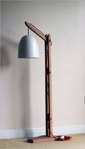 Apartment Joao Crisostomo Ii A Modern Apartment With White Interiors And A Wooden Floor Wooden Floor Lamps Unique Floor Lamps Wood Floor Lamp