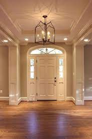 Entry Foyer Hallway Doors Lighting Chandelier Light Hardwood Floors Moulding Windows Architecture Light Hardwood Floors Light Hardwood Craftsman Style