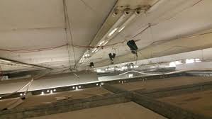An Asbestos Insulating Board Ceiling Located Above A Newer Suspended Ceiling Port Talbot Uk