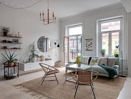 Consider placing a printed throw blanket with the same shade of blue over an accompanying chair. Light And Pleasant Scandinavian Apartment With Blue Sofa 79 Sqm Photos Ideas Design