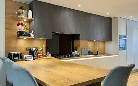 White handleless lacquer kitchen with terra oak in uckfield. Dark Grey Kitchen With Vintage Oak Worktops