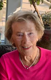 Can someone remove the shadows from his face for an obituary photo?