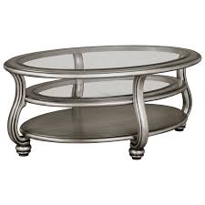 Ashley furniture coffee table with artificial flower arrangement #homesweethome. Ashley Signature Design Coralayne T820 0 Oval Cocktail Table In Silver Finish With Glass Top Dunk Bright Furniture Cocktail Coffee Tables