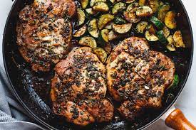 Place zucchini over the onions. Garlic Butter Herb Pork Chops Recipe With Zucchini Best Pork Chops Recipe Eatwell101