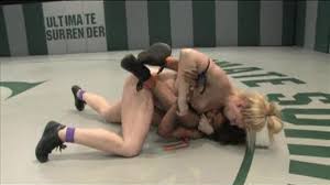 Tough nude girls fight each other in a ring