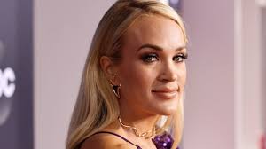 Carrie Underwood shows off toned physique as she surprises fans with a  bare-faced selfie