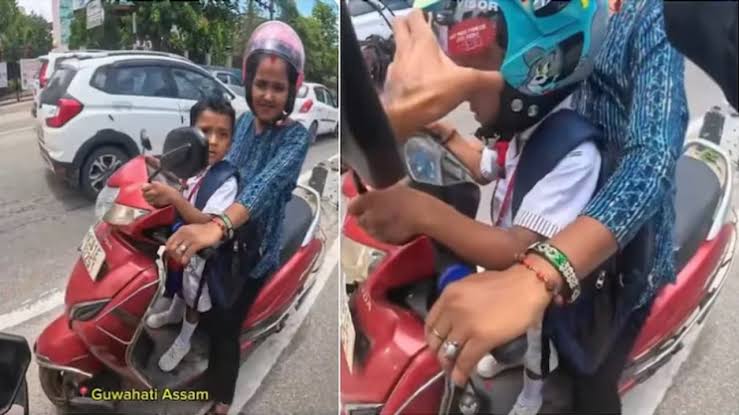 Assam biker Leki Goswami gifts Tom and Jerry helmet to helmetless boy in Guwahati; video wins hearts online