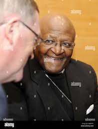 Archbishop Desmond Tutu receives his University of British Columbia (UBC)  Honorary Doctor of Laws Degree while fellow recipients Shirin Ebadi and the  Dalai Lama and UBC Chancellor Allan McEachern (L) and UBC