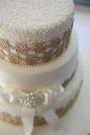Our Wedding Cake White Piping Over Ivory Icing With Gold Belgian Lace Winter Wedding Janet Ridley Photography Winter Wedding Cake Wedding Cakes