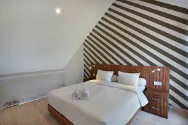 This idea makes the living room look larger than its size. The Bedroom On Mezzanine Floor Askara Canggu Townhouse