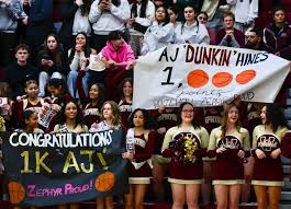 Whitehall's AJ Hines (23) muscles his way against William Allen to score  his 1000th career point