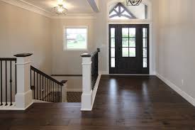 Dark Brown Hickory Hardwood In Entry With Black Door Modern Style Homes Black Doors Residential