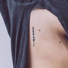 Live a little tattoo simple tattoo small tattoo rib tattoo. Minimalist Rib Tattoo Women Novocom Top