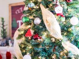 Instead of putting mesh straight up and down on your tree, move it around the tree at a diagonal. Diy Christmas Tree Decorating With Deco Mesh Modern Mom Life