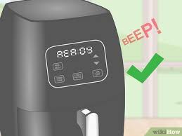 Put the chicken into the rotisserie holder in the nuwave brio 14 q air fryer oven. Ø§Ø³ØªØ®Ø¯Ø§Ù… Ù…Ù‚Ù„Ø§Ø© Ù†ÙˆÙˆÙŠÙ Ø§Ù„Ù‡ÙˆØ§Ø¦ÙŠØ© Wikihow