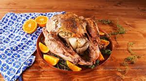 To safely stuff a turkey, make sure to do it right before it goes in the oven, not ahead of time. We Tried Snoop Dogg And Jamie Oliver S Thanksgiving Turkey Recipes And There Was A Clear Winnerdelish Herb Turkey Turkey Recipes Turkey Recipes Thanksgiving