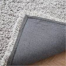 Revel in the plush texture of this shag rug between your toes while bringing a contemporary style into your sitting room. Cozy Plush Rug