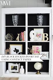I actually used electrical tape for this project because it was the perfect size. Diy Black Backed Bookcase Using Contact Paper Monica Wants It