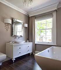 Opt for neutral bathroom colors, such as crisp white, cool gray, and rich brown, for a beautifully birch woods wallpaper in shades of taupe inspired the color palette for this powder room redo. Creating A Stylish Taupe Bathroom Decor