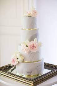On Trend Four Tier Marble Wedding Cake With Gold Details And Blush And Cream Flowers Www Wedding Cake Marble Floral Wedding Cakes Wedding Cakes With Flowers