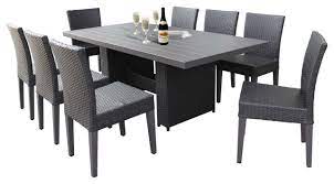 Shop for patio dining sets and bring your favourite humans together with the perfect dining table. Belle Rectangular Outdoor Patio Dining Table With 8 Armless Chairs Espresso Tropical Outdoor Dining Sets By Tk Classics Houzz