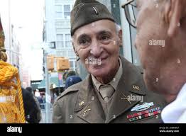 WWII veteran Eugene Cannava, 86, from New York, left, chats with Korean War  veteran Samuel Benchimol, 81, from Glen Head, N.Y., as they wait to march  up New York's Fifth Avenue in