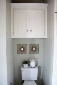 Another idea is to hang the cabinet, and then hang hooks from the bottom or front door. Bathroom Cabinets And Shelf Design Ideas Styleheap Com Bathroom Cabinets Over Toilet Over Toilet Diy Bathroom Storage