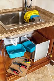 In addition to the warping, there is also the trouble of mold and buildup of waste water sediment that will give your kitchen a foul odor. Repair Of Hydraulic Valve Kitchen Sink Set Of Keys And Screwdrivers And Pliers Lie Side By Side On A Suppor 166886090 Larastock
