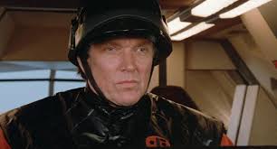 Nice talking to you. Hey, aren't you going to say goodbye? I didn't hear  you say goodbye. I wanna hear you say goodbye!" The shocktrooper officer  takes aim with his rifle and