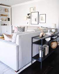 It is typically long, not shorter than 4 feet, and similar in height to the back of the sofa. I Got So Tired Of Seeing The Back Of Couch All The Time So I Searched Hi And Low For A Long Console Table Behind Sofa Skinny Console Table Living