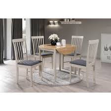 Have you contemplated painting your old oak furniture or cabinetry? Dining Room Furniture Kyla Painted Solid Wood Round Drop Leaf Dining Table Oak Finish Painted Extension