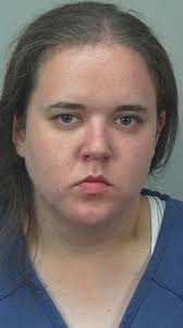 Official: Oregon woman kicked officer, spit in another officer's face