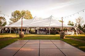 Outdoor Cafe Lighting Draped Over A Dance Floor Lighting Support Poles Are Made Out Of Whiskey B Outdoor Wedding Lighting Dance Floor Wedding Party Lights Diy