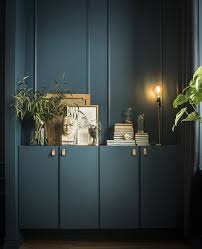 Two Ivar Cabinets Are Custom Painted In The Same Shade As The Walls And Hold Books Artwork Plants And A Lamp Ikea Ivar Cabinet Ikea Cabinets Furniture Hacks