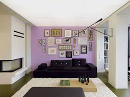 This Light Lavender Accent Wall Is Filled With An Array Of Prints And Artwork That Take Up Ne In 2020 Living Room Colors Cozy Living Room Design Monochrome Living Room