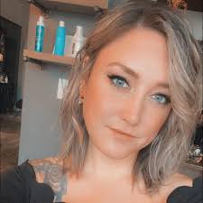 Hi y'all! My name is Olivia, I am a haircutting specialist at Grand Noir  Salon in Verona. I specialize is layers, shags, mullets, and bobs. But  truly I love doing all haircuts!