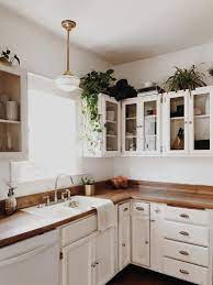 8 Ideas For Decorating Above Kitchen Cabinets Decorating Above Kitchen Cabinets Above Kitchen Cabinets Kitchen Design