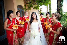 I Love The Combination Of The Traditional Wedding Gown And The Bridesmaids In Saris What Indian American Weddings Indian Fusion Wedding Trendy Wedding Dresses
