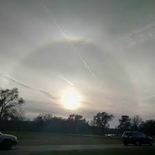 A sun halo is caused by the refraction, reflection, and dispersion of light through ice particles suspended within thin, wispy, high altitude cirrus or cirrostratus clouds. What Is A Sun Halo Iscn