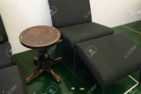 Check spelling or type a new query. Photograph Of Small Wooden Vintage Coffee Table And Black Regular Box Room With White Walls And