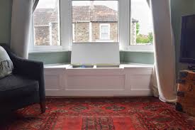 Attach 2×4 studs to the back of the bay window. How To Build A Victorian Bay Window Seat With Storage