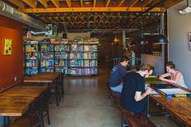 A dinner table full of willing whisperers. 10 Fun Restaurants That Combine Food And Drink With Gaming Travel Channel