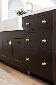 Studio mcgee is one of the most recognised interior design studios in the industry and with over 1 the warmth of the hardware works beautifully against the putty cabinets and the rich stained wood beneath the island too. The Mcgee Home Kitchen Tour Studio Mcgee