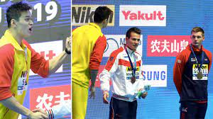 Britain's duncan scott, right, refuses to pose with sun yang, flanked by katsuhiro matsumoto, left, and martin malyutin, after the 200m the world got a flash of the infamous temper of chinese controversy sun yang when britain's duncan scott staged a silent podium protest in. Sun Yang Shirt Fronts Duncan Scott Over Second Podium Protest Mack Horton