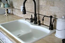 white sink with dark faucet and